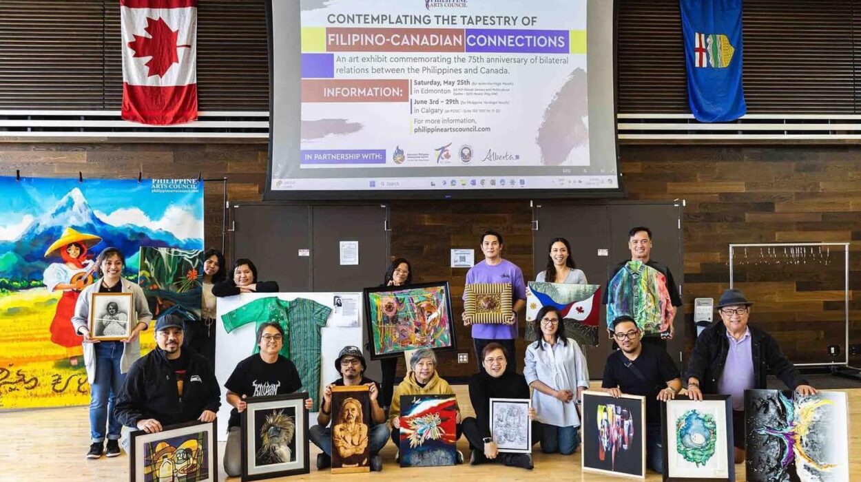 All the Filipino artists who attended gather together showing one artwork each that they brought to the exhibit on May 25. Credit: Philippine Arts Council
